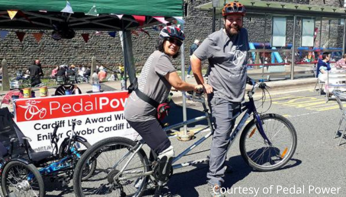 Picture of man and woman on a tandem bike