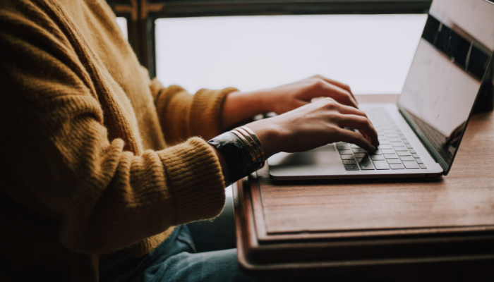 Picture of someone at a laptop