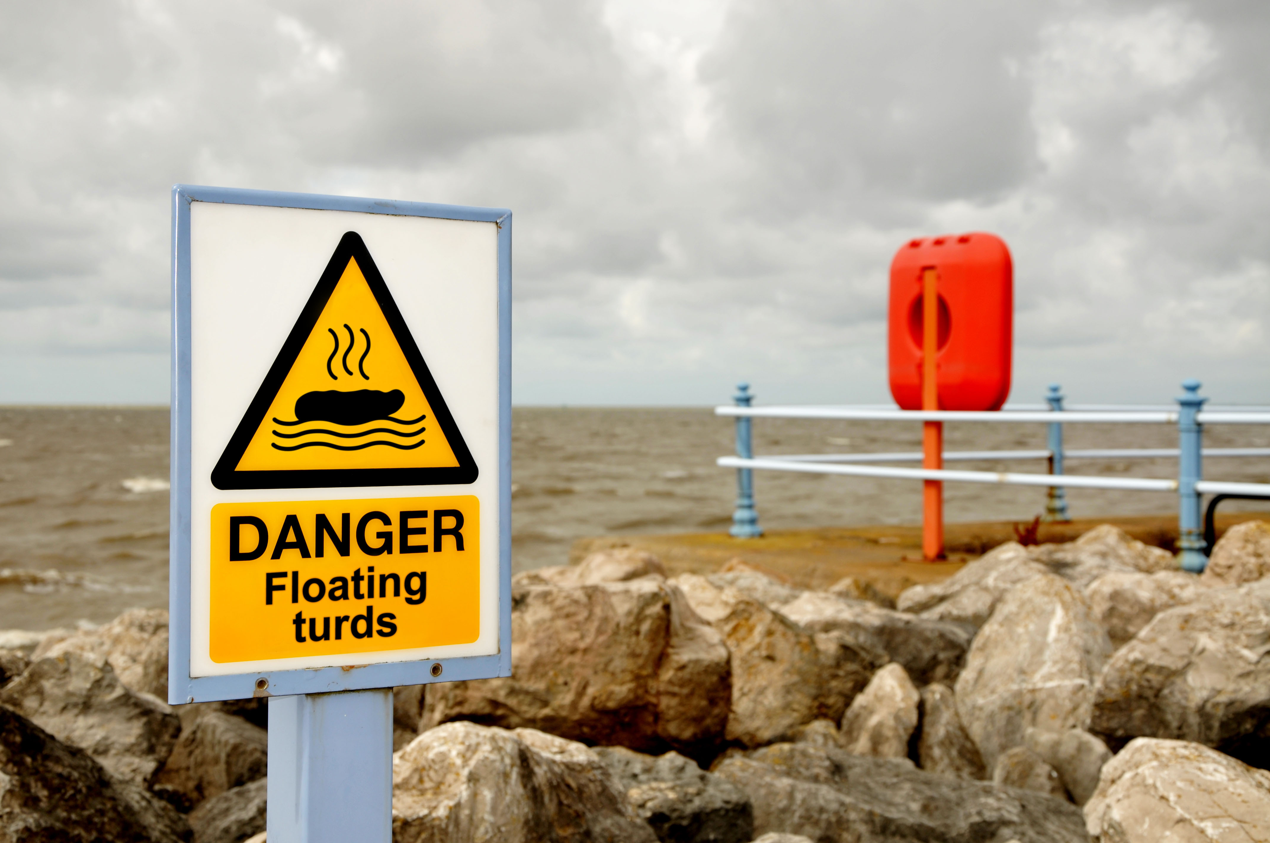 Floating turds sign