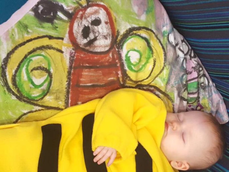Baby in a bee costume