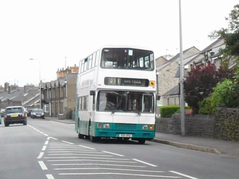 Bus travelling on a road (creative commons)