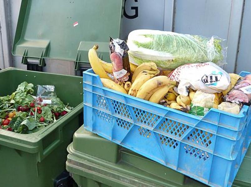 Food in wheelie in and food in a crate.