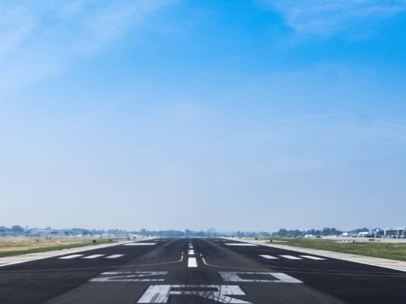 Image of runway with text 'The Cardiff to Anglesey airlink subsidy is to be scrapped'
