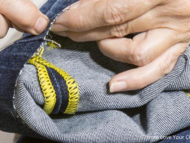 Someone mending jeans