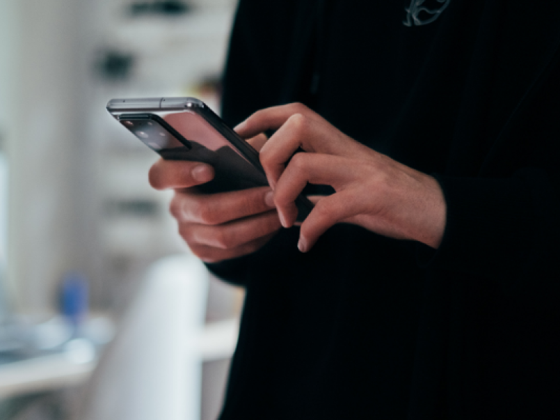 Someone holding a mobile phone