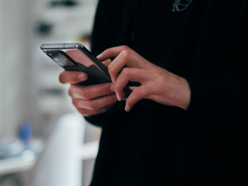Someone holding a mobile phone