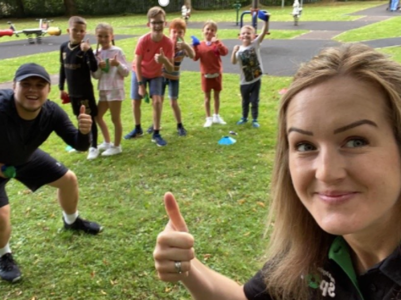 Picture of the staff of Play it Again sport, with some kids