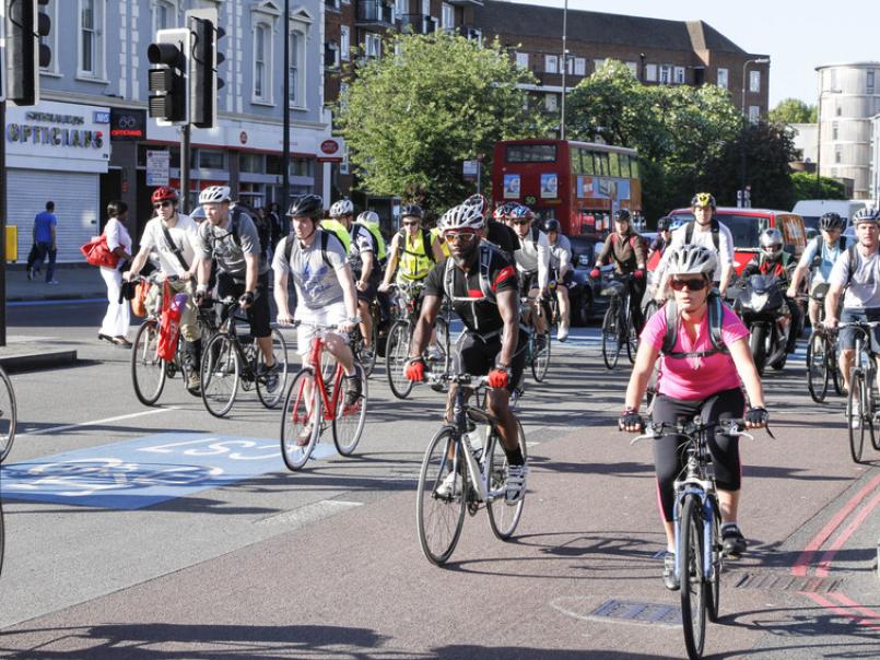 Picture of people cycling on a road