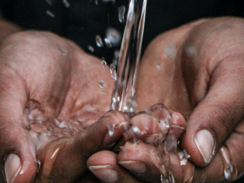 Water running through hands