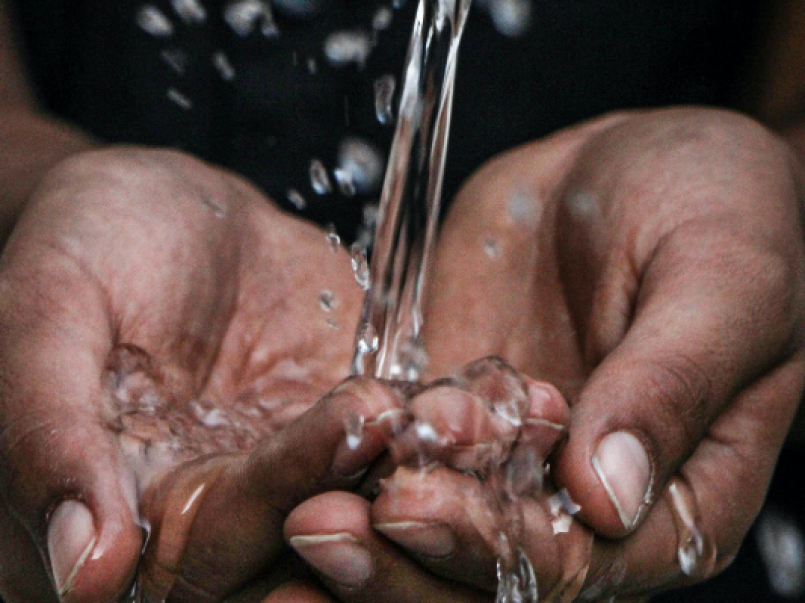 Running water running into someone's hands