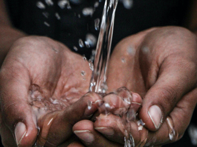 Water running through hands