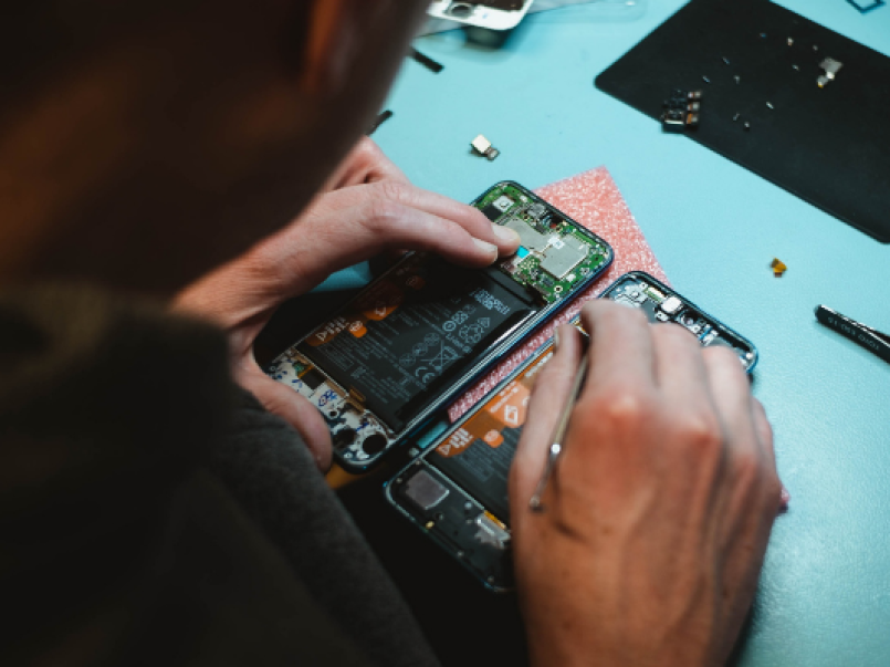 Someone repairing a mobile phone