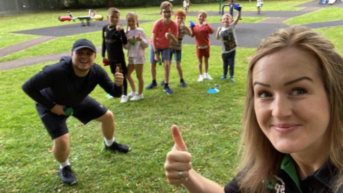 Picture of the staff of Play it Again sport, with some kids